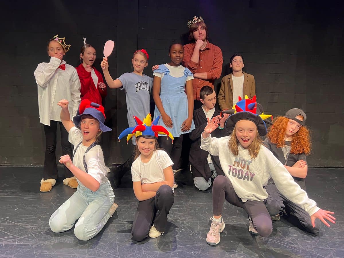 Photograph of young kids wearing costumes after a performance at the Tuggeranong Arts Centre.